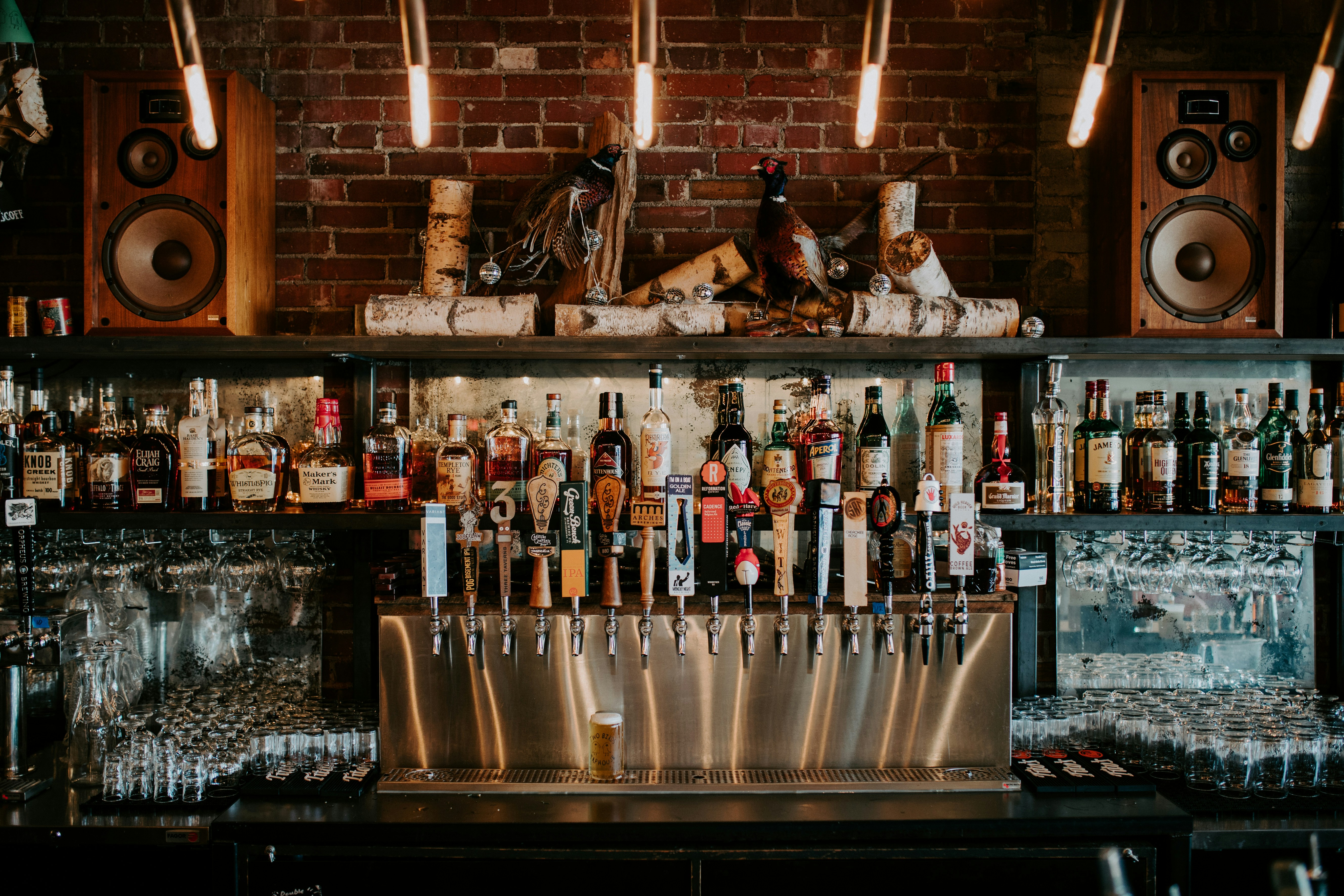 a bar with many bottles of alcohol