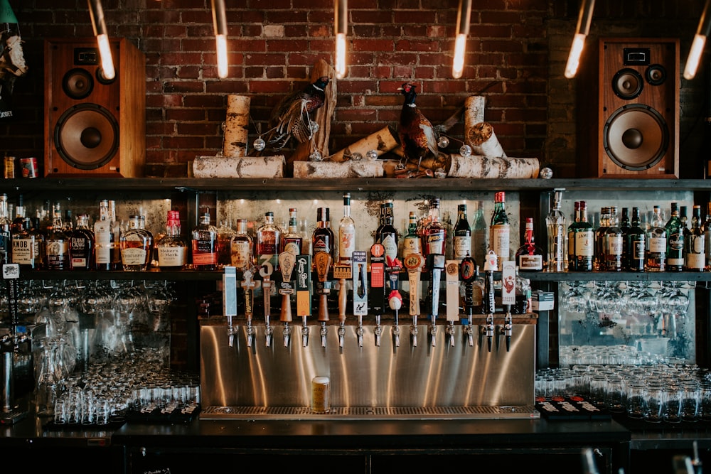 a bar with many bottles of alcohol