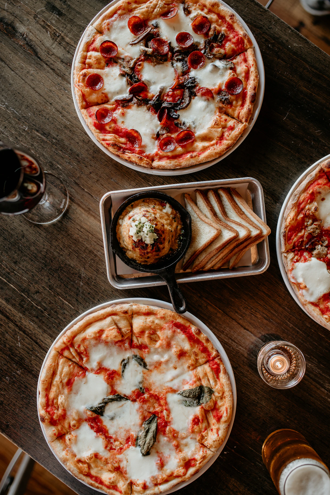 Pizzas served at a restaurant table; illustrative dining photograph