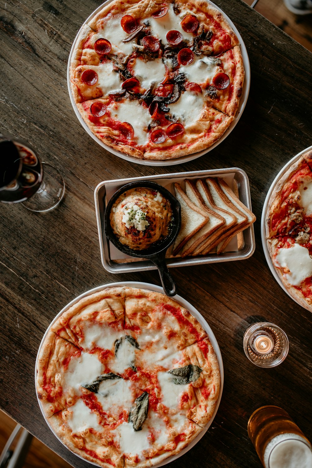 pizzas on plates on a table