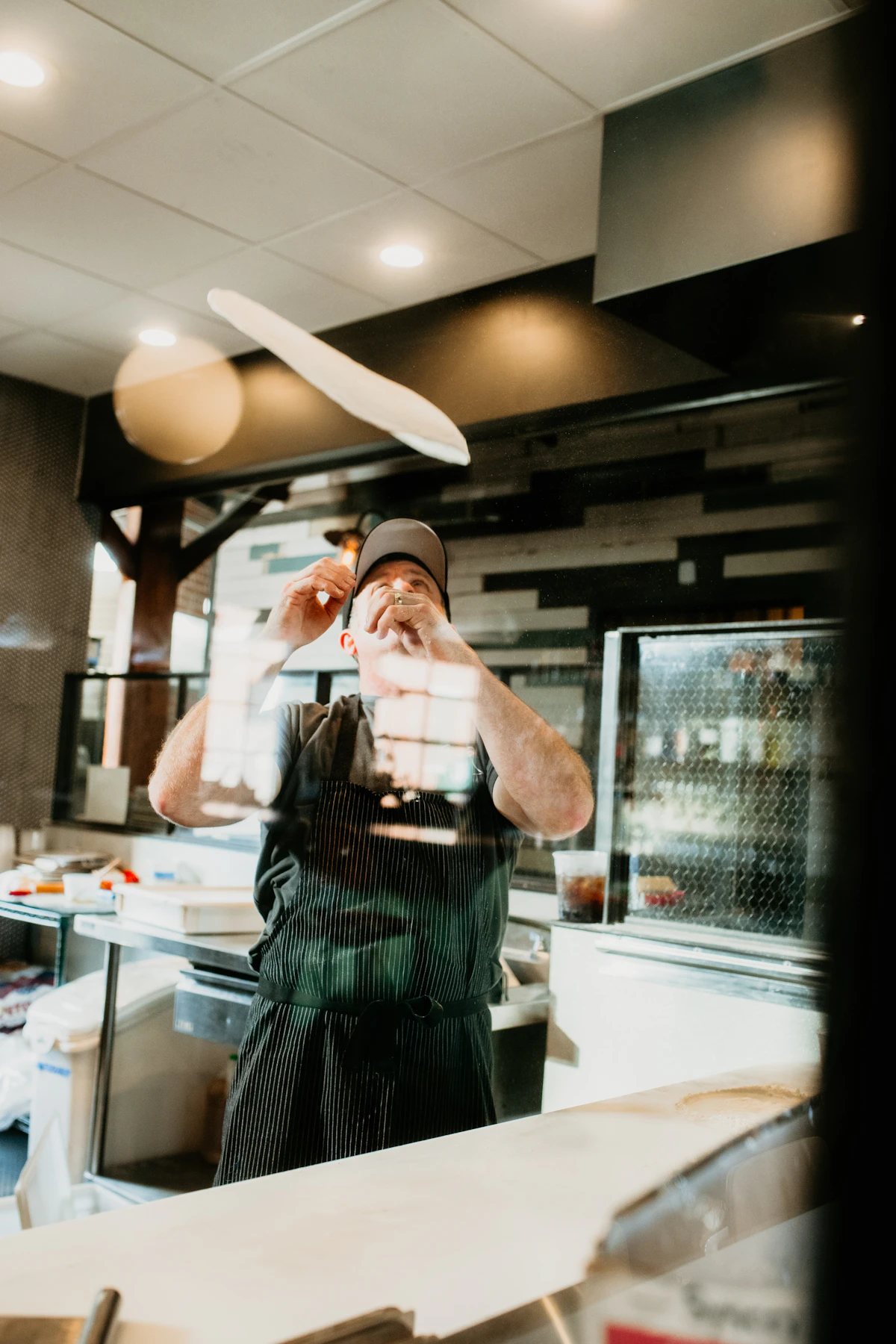 The head chef plating at the pass