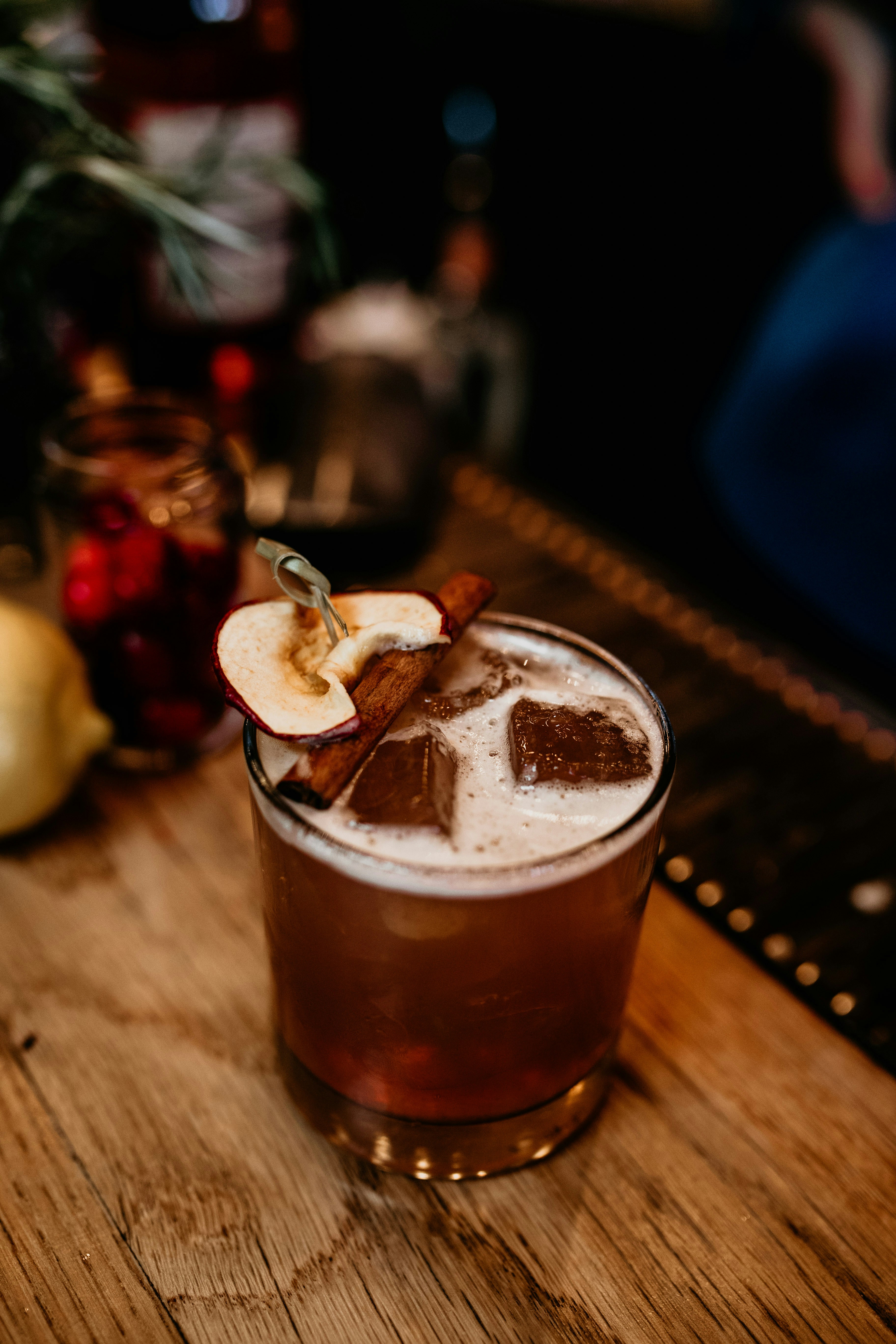 a glass of liquid with ice cream and a spoon