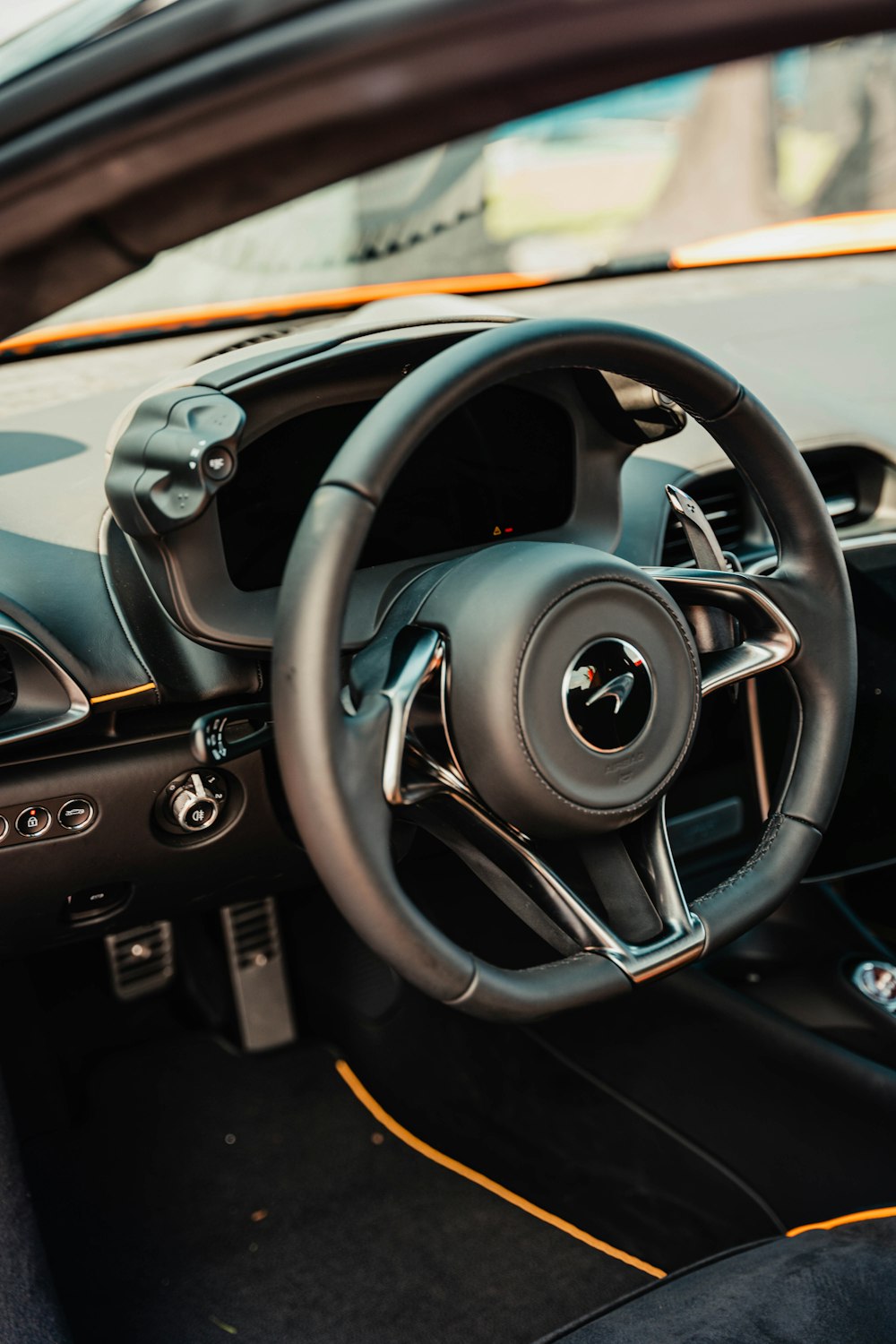 a steering wheel and dashboard of a car