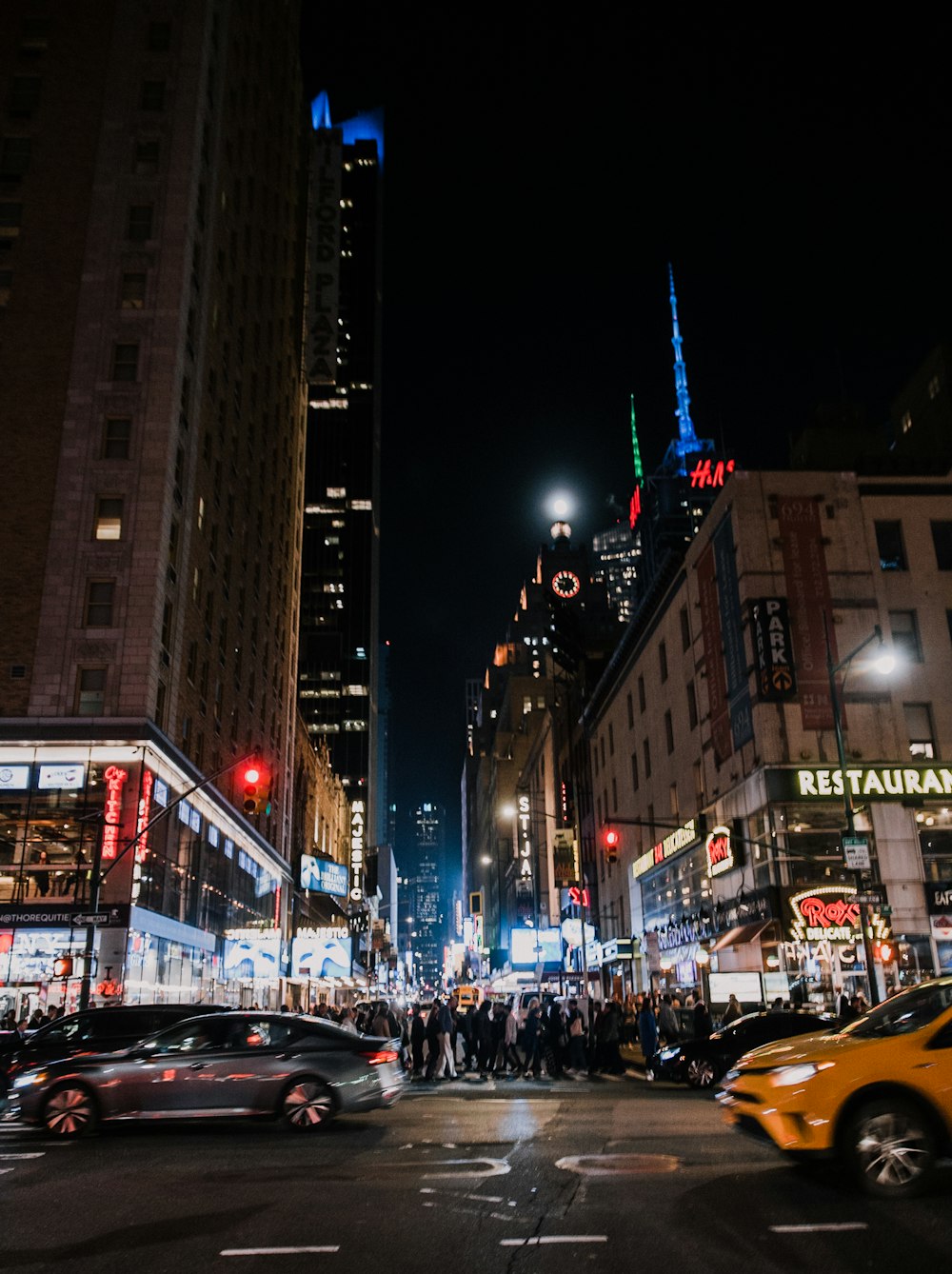 a busy city street at night