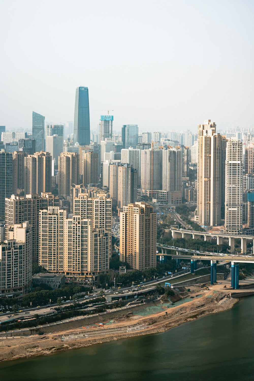 a city skyline with a river