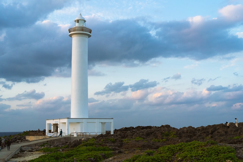 a white tower on a hill