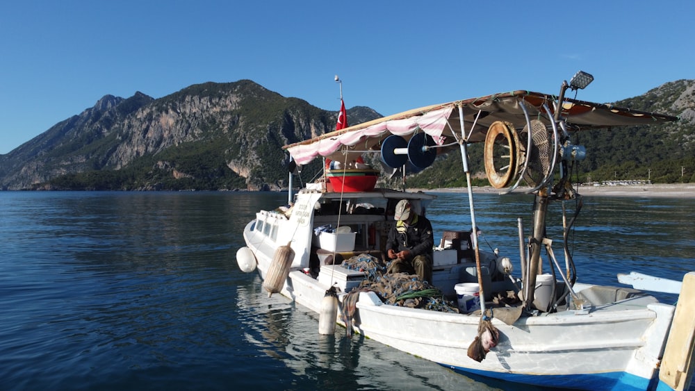 a boat with a canopy on the water