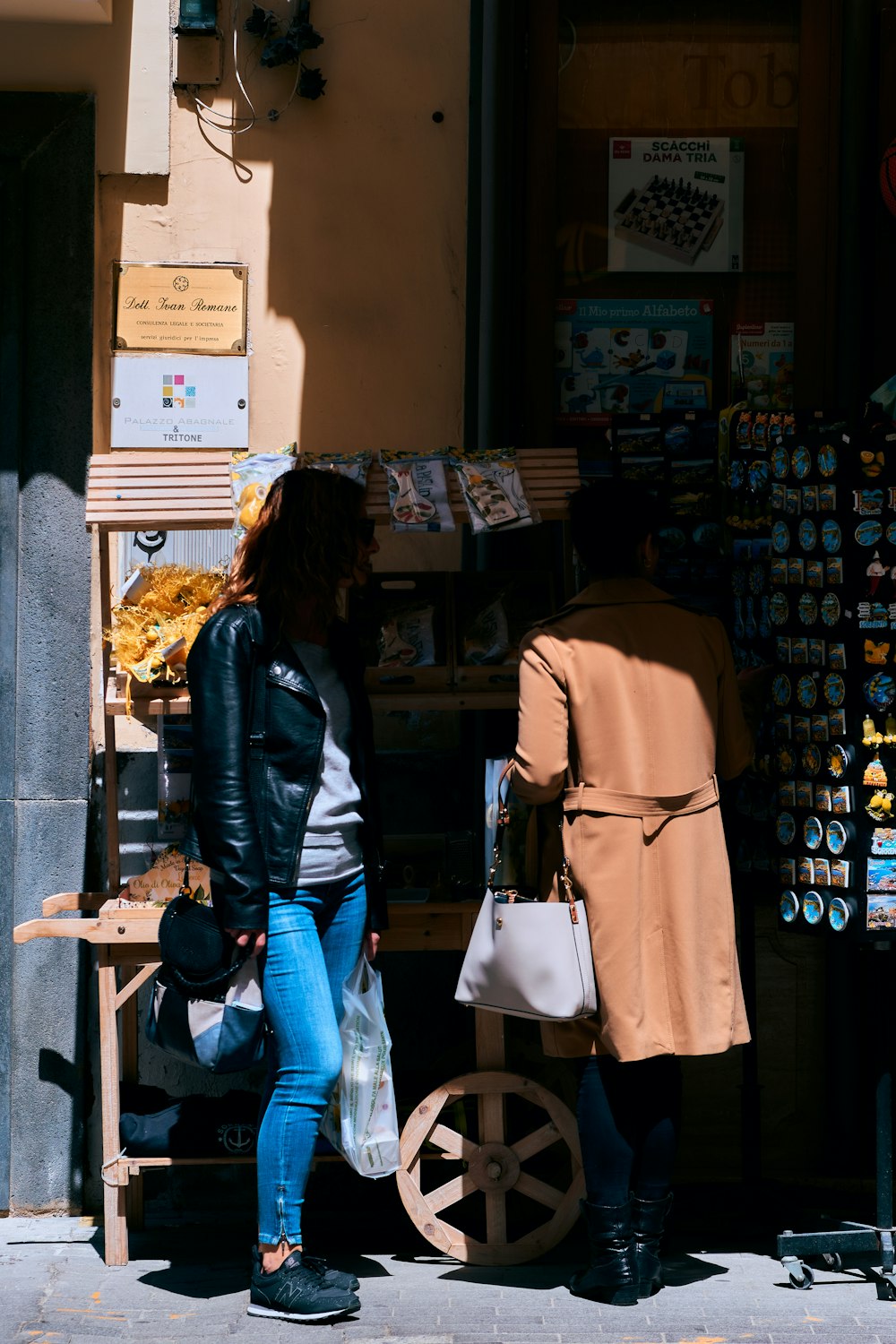 a couple of people standing outside a store