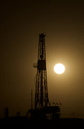 a large tower with a sunset in the background