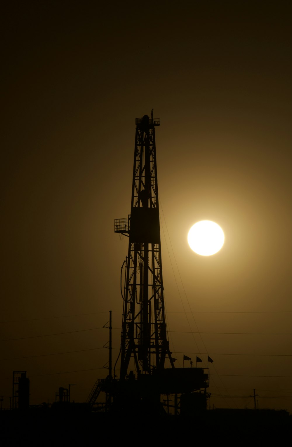 a large tower with a sunset in the background