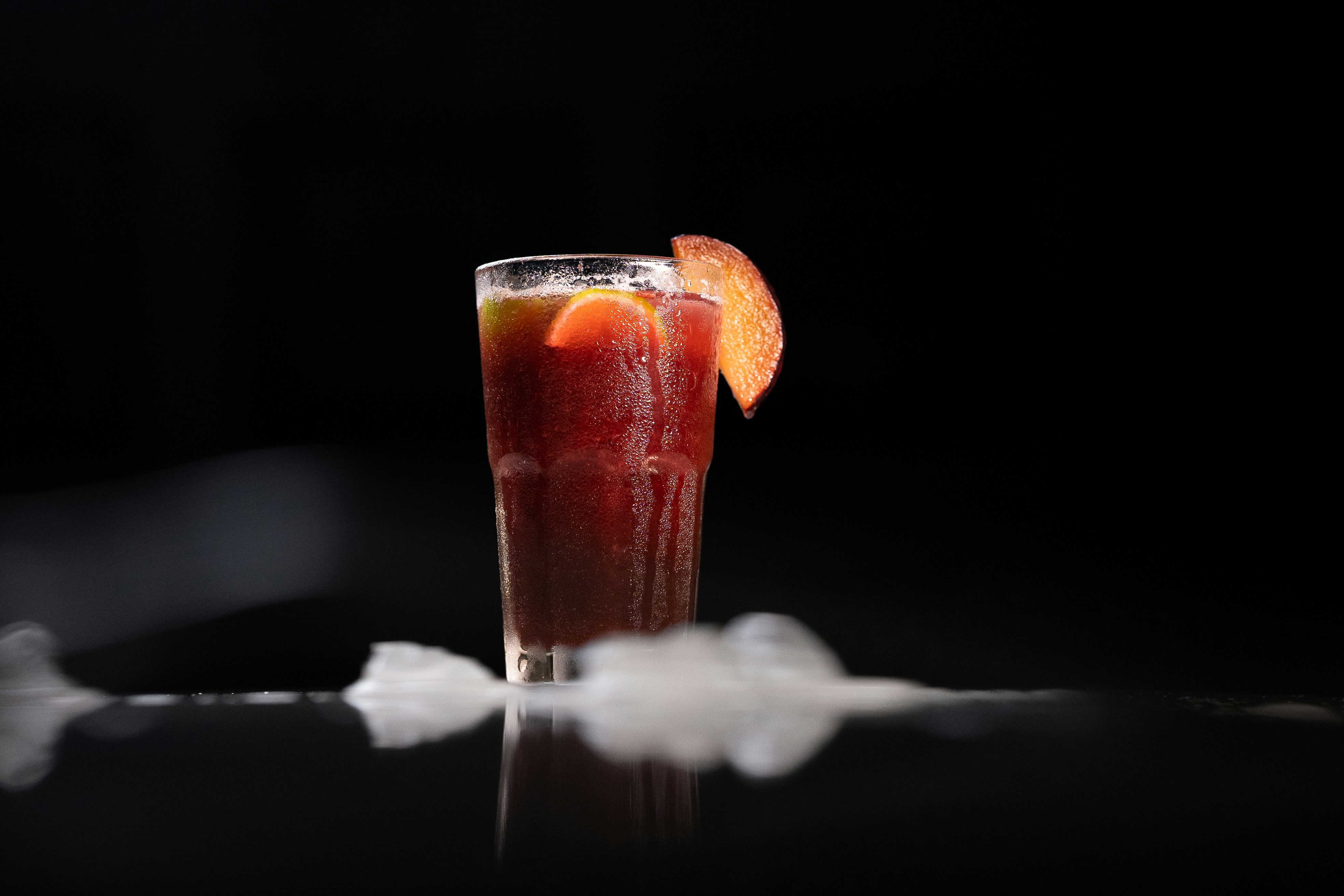 a drop of water falling into a glass of water
