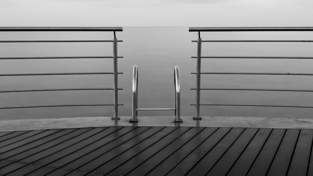 a wood deck with a metal railing