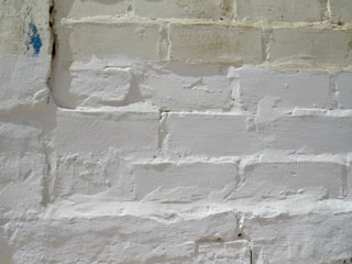 Close-up of a clean brick facade after soda blasting, showing restored texture and color.
