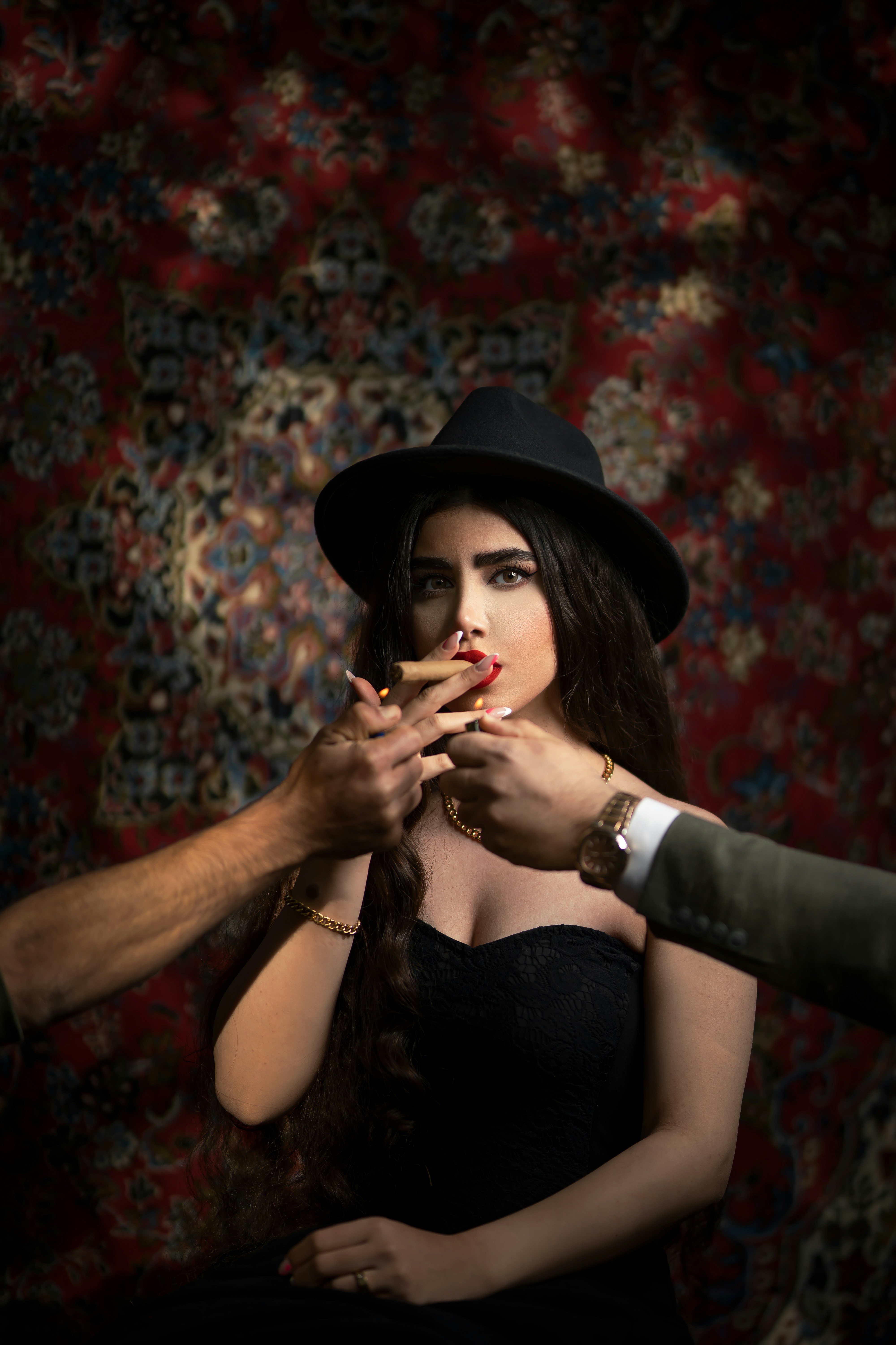 a person wearing a hat and smoking a cigarette