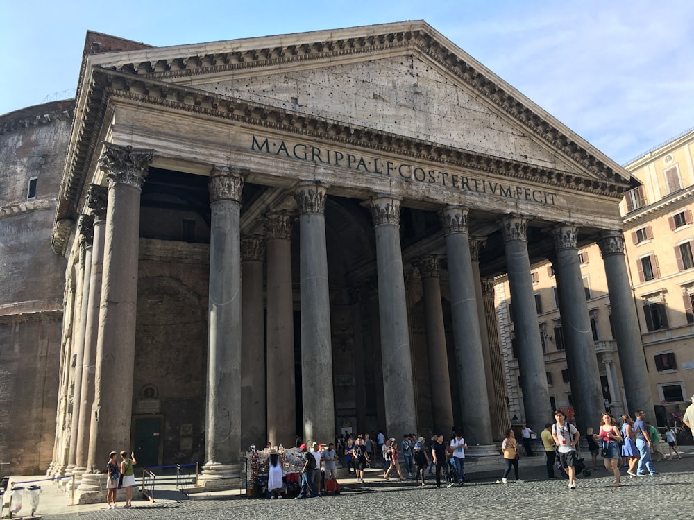 Pantheon, Rome with columns and people standing in front of it