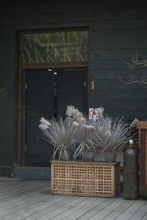 A spacious resin lockable deck box in a backyard setting.