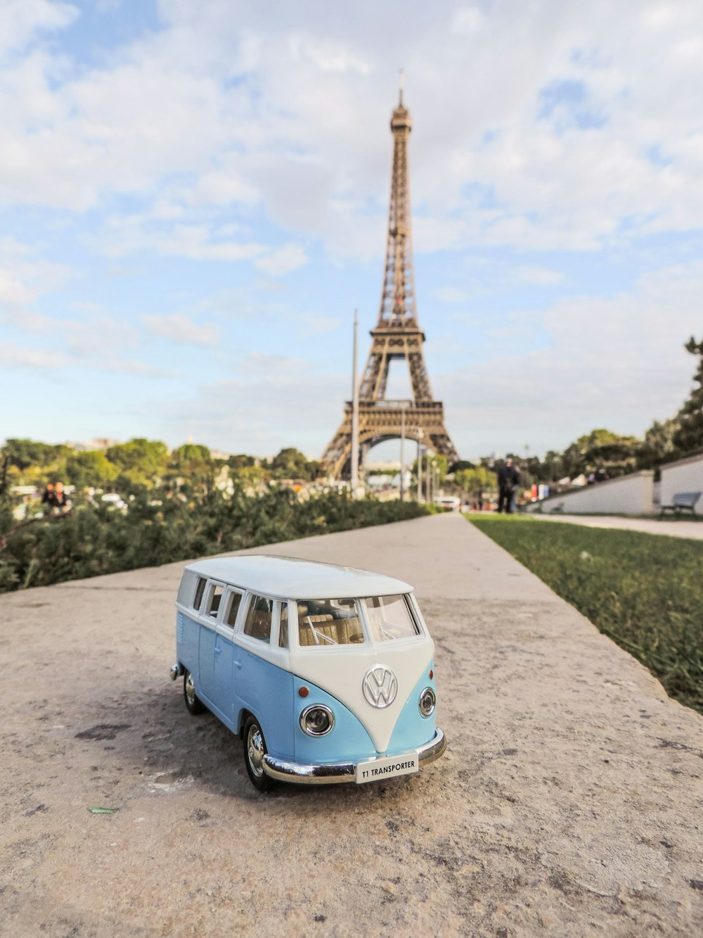 a bus parked in front of a tall tower