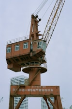a crane lifting a building
