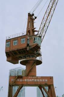 a crane lifting a building