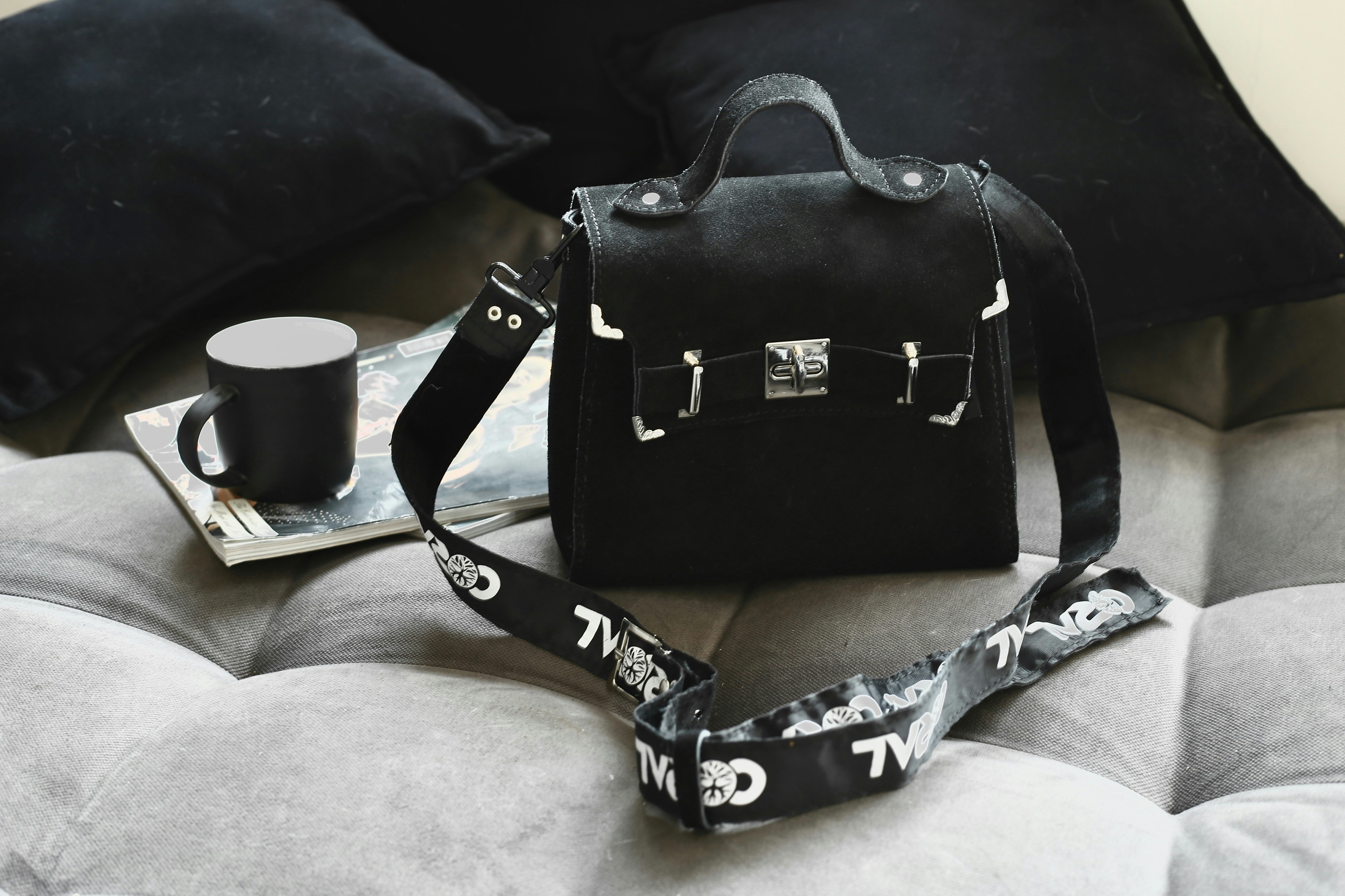 a bag and a cup of coffee