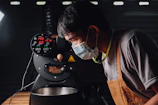 Technician adjusting temperature settings on a califrio coffee machine.