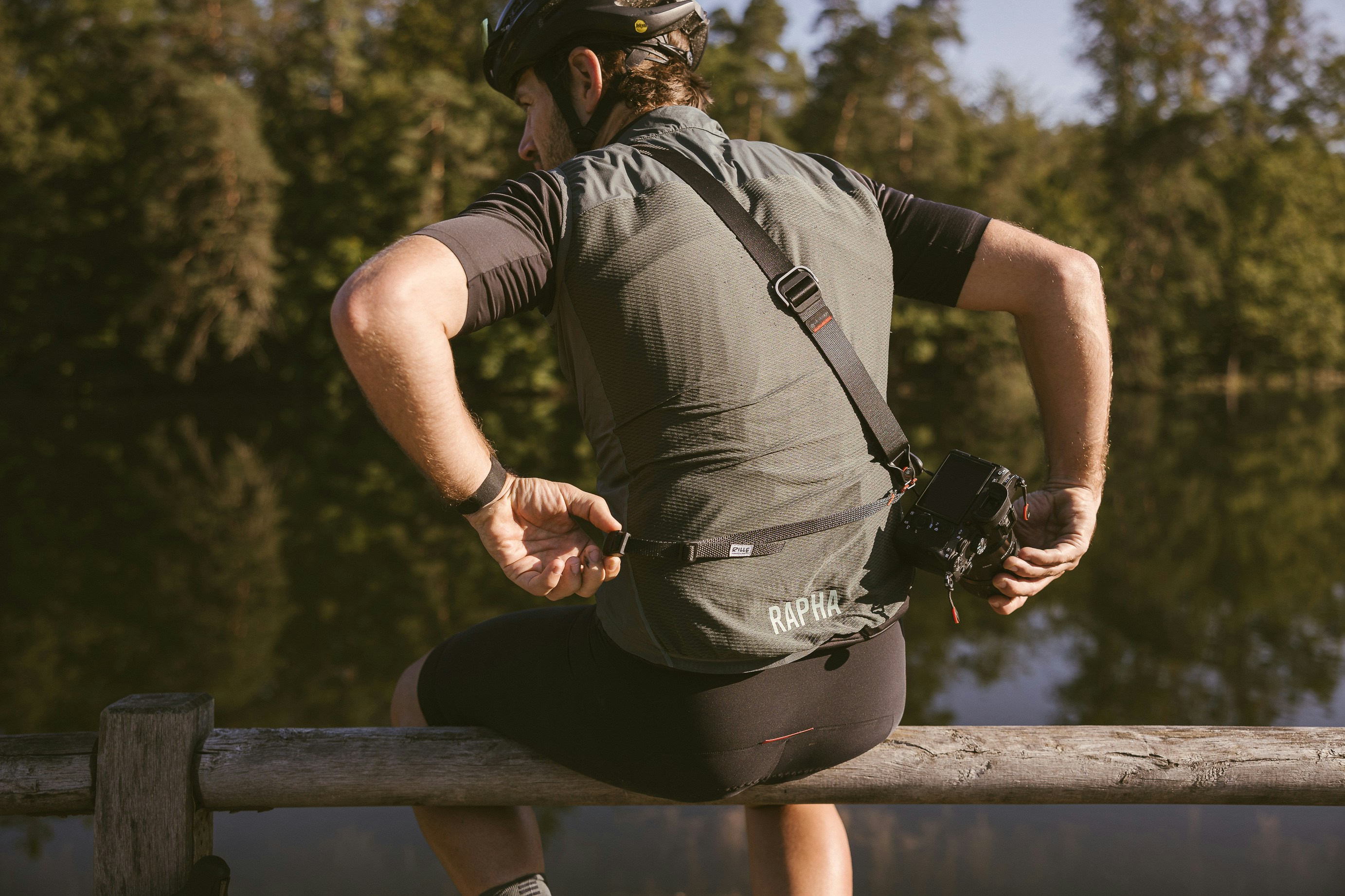 a person wearing a helmet and holding a camera