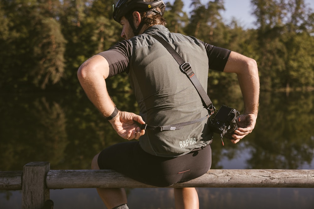 a person wearing a helmet and holding a camera