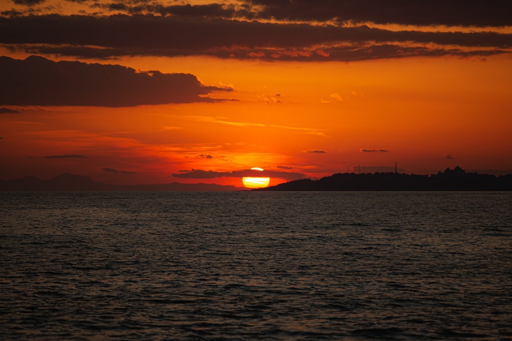 a sunset over a body of water