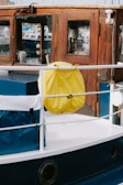 a boat with a yellow cloth from the front
