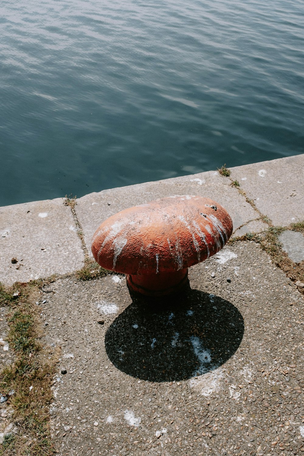 a red ball on a concrete surface