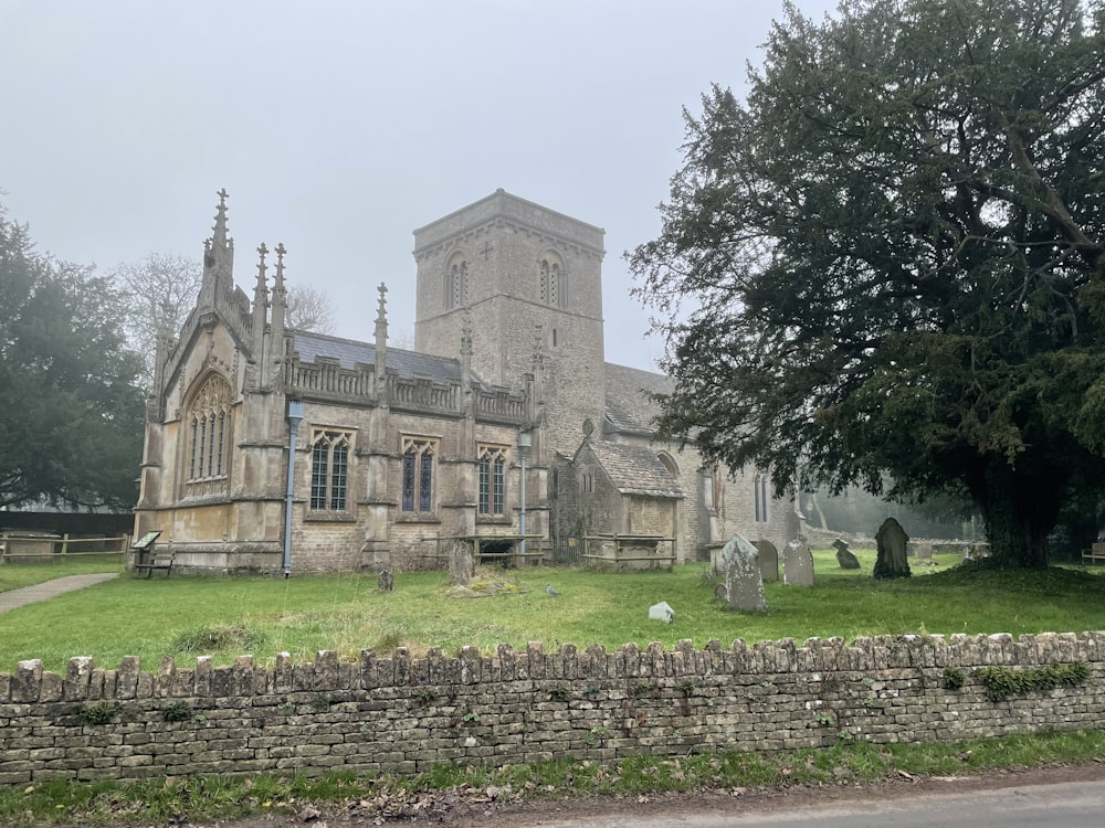 a stone building with a graveyard