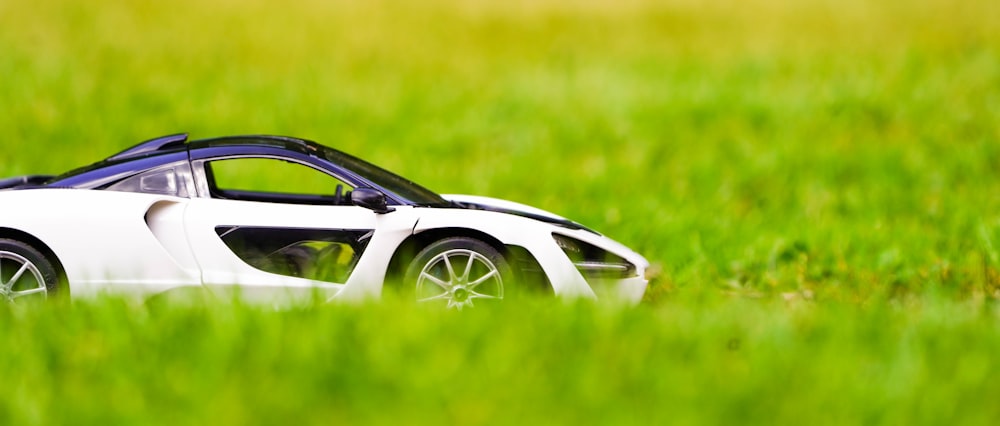 a white car parked in a field