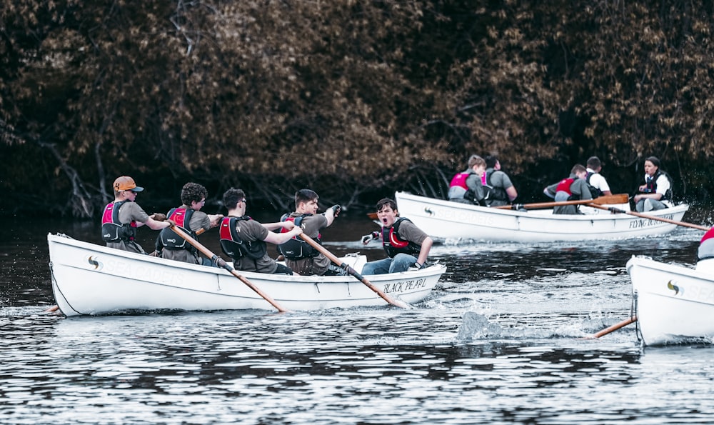 a group of people rowing a boat