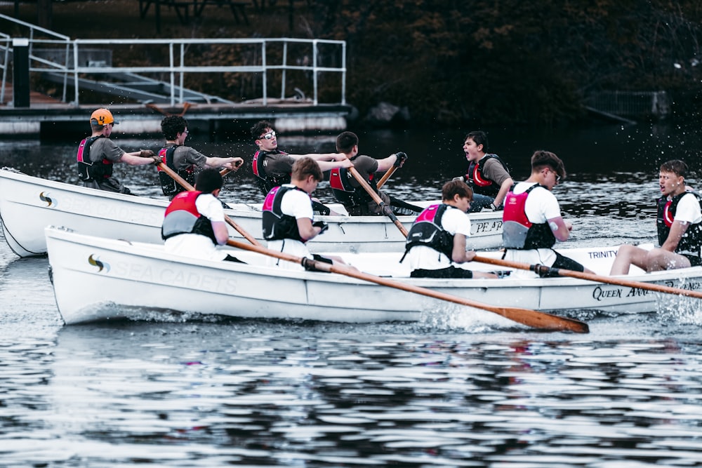 a group of people rowing a boat