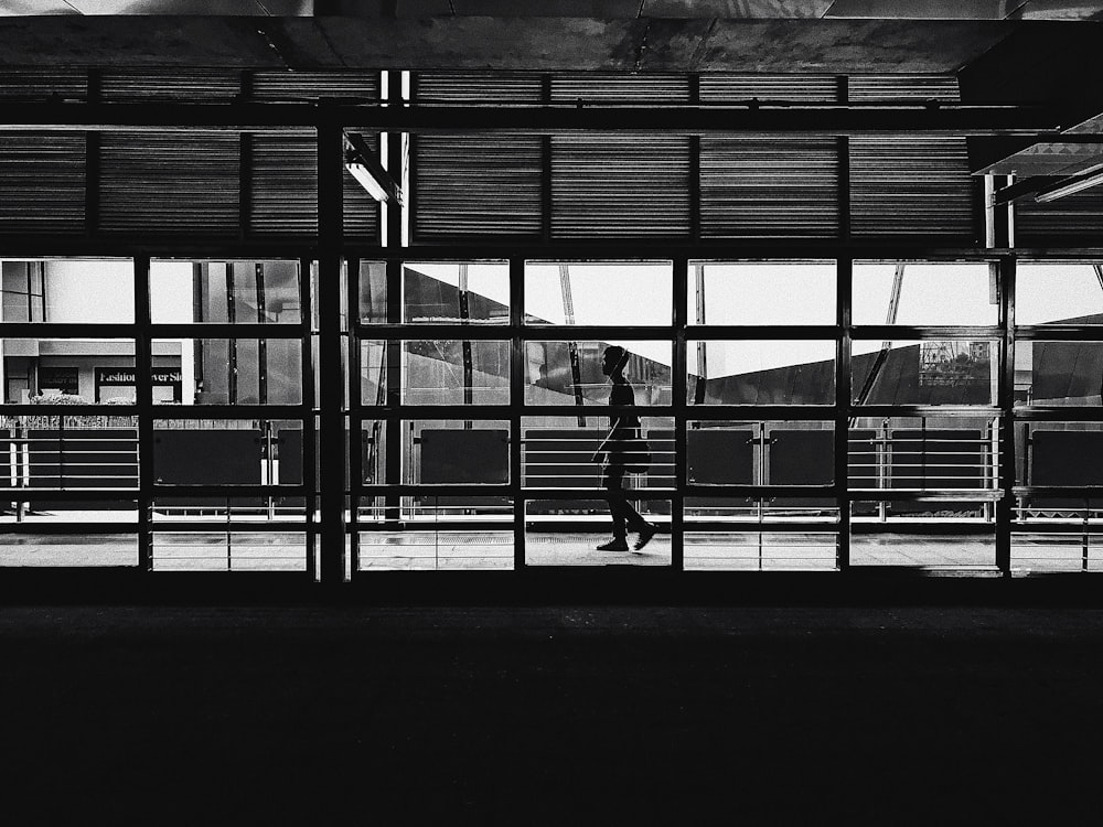 a person skateboards in a large building