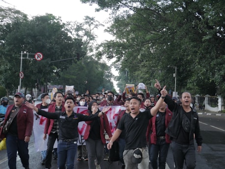 a group of people walking down a street