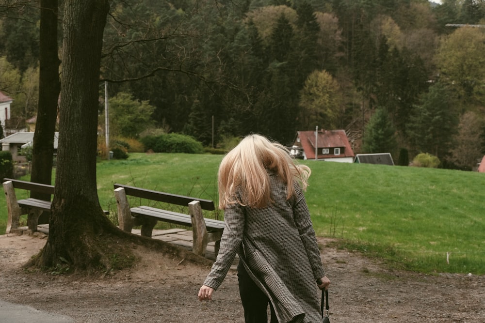 a person walking on a path in a park