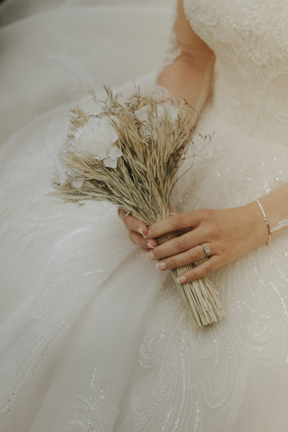 a person holding a wedding bouquet