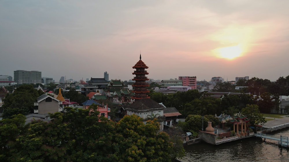 a city with a river and a tower