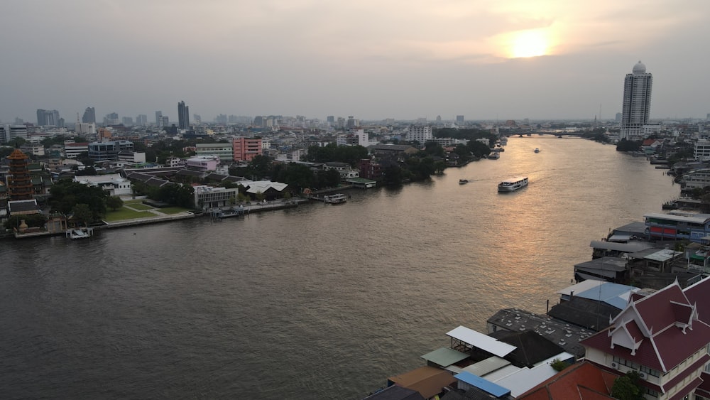 a river with buildings and boats