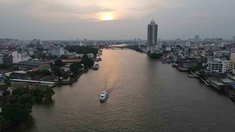 a river with boats and buildings along it