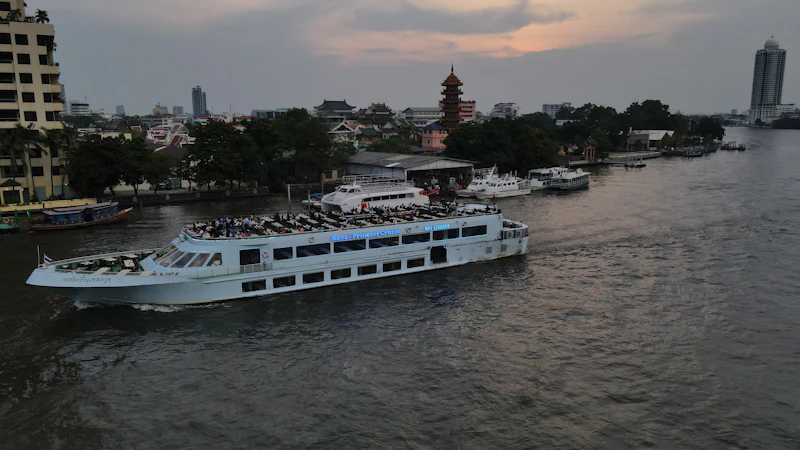 A family riding a Bangkok river boat on the Chao Phraya
