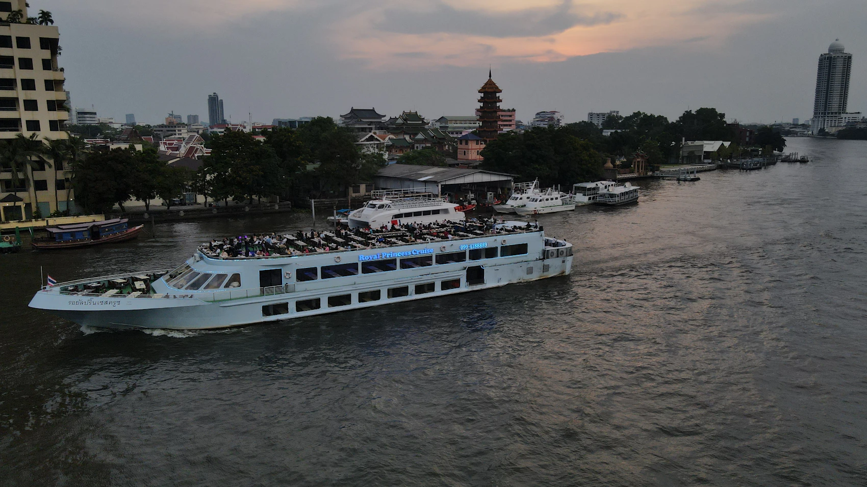 A passenger boat travelling along Bangkok's Chao Phraya River