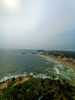 a beach with a body of water and a city
