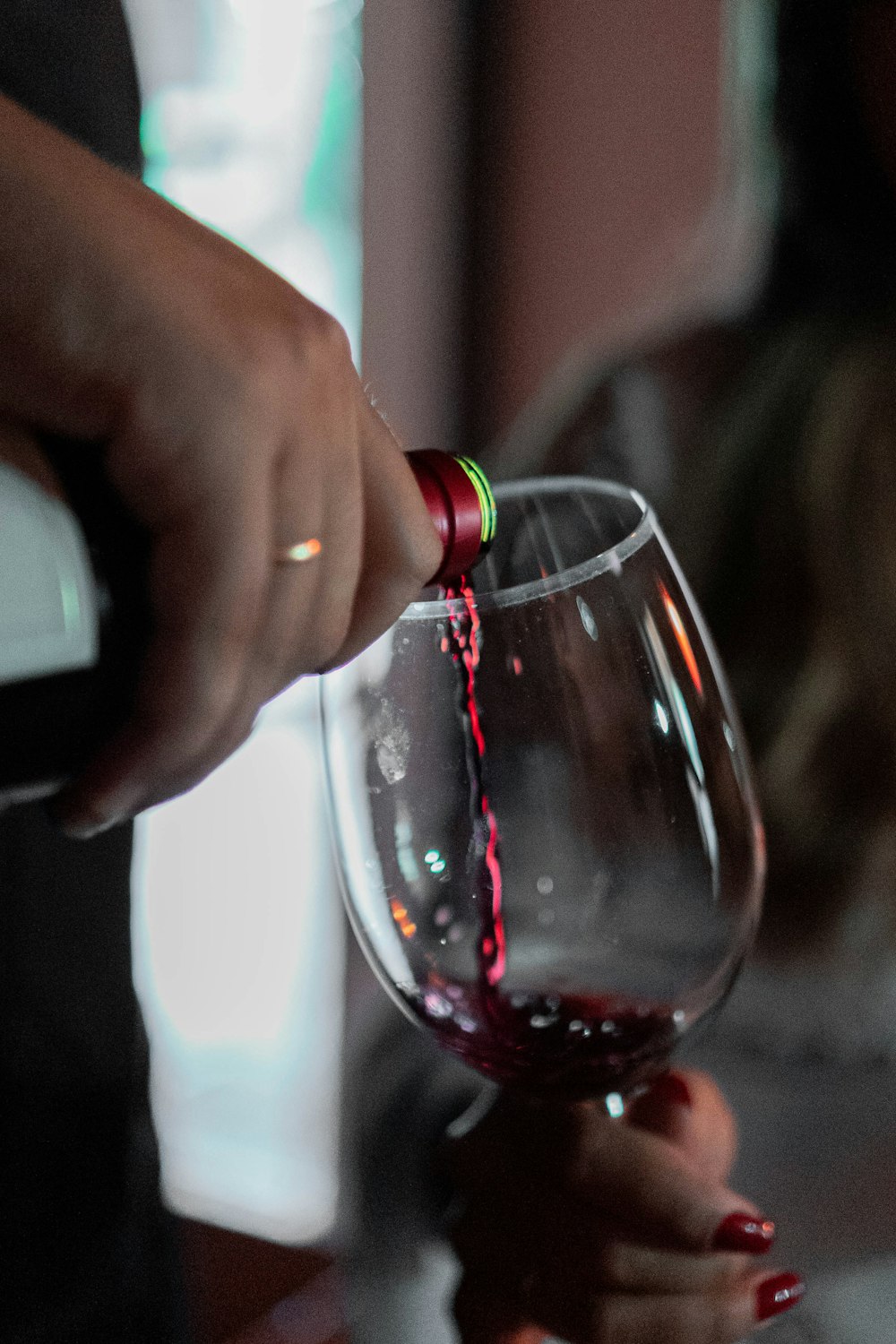 a person holding a wine glass