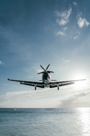 a helicopter flying over water