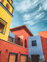 Traditional Sinaloan architecture with bright colors and detailed craftsmanship.