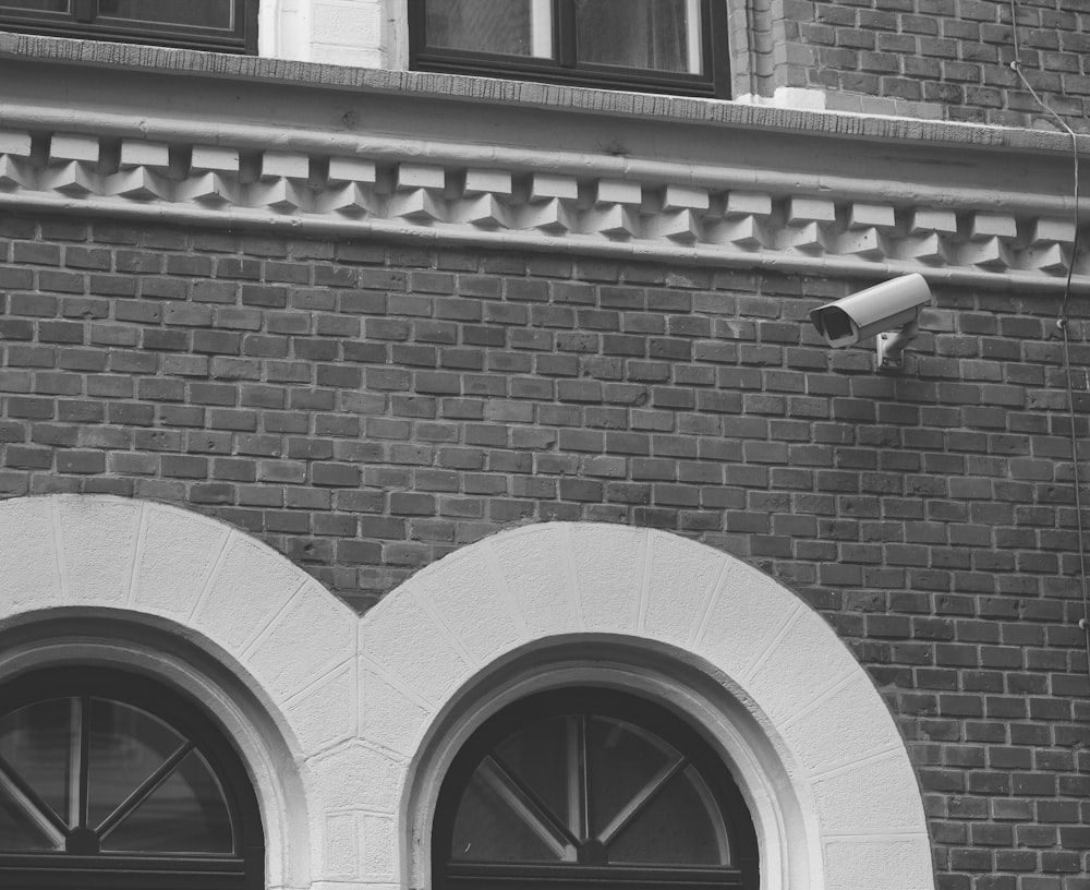 a camera on a brick building