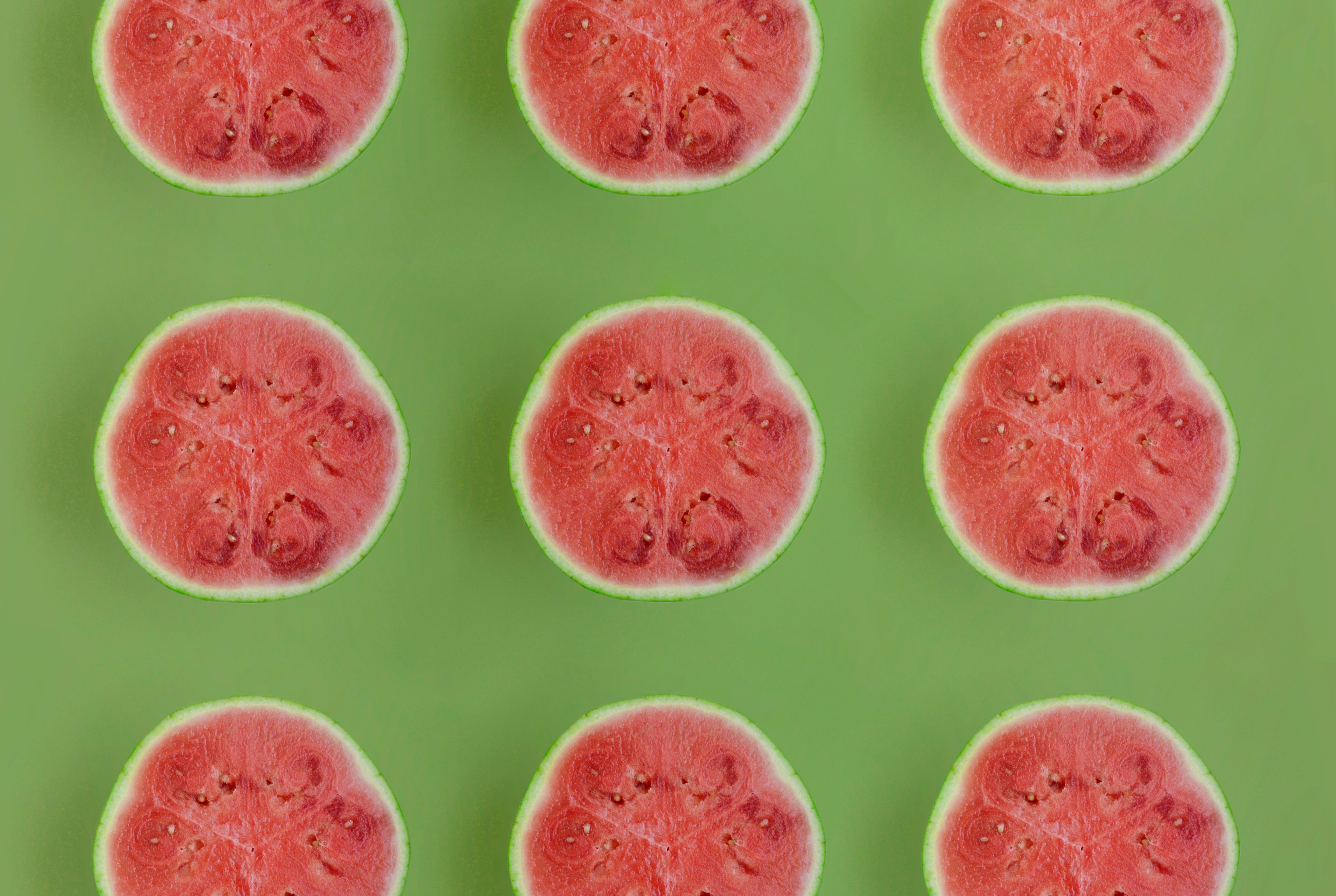 Three rows of sliced watermelon.