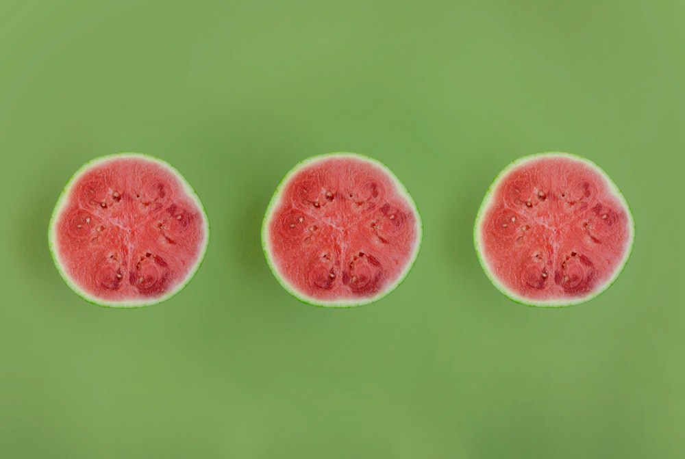 a group of pink and white round objects